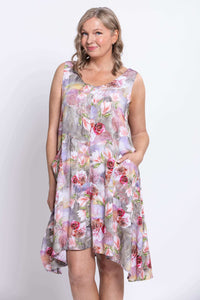 Upper body close-up of model in floral Gia Dress with V-neckline and pockets