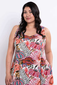 Upper body close-up of model in sleeveless floral dress