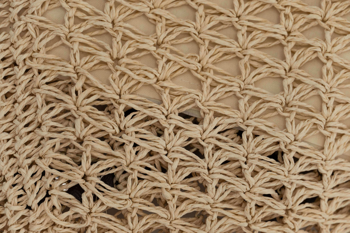 Macro detail of the intricate natural woven texture of the eco-friendly backpack