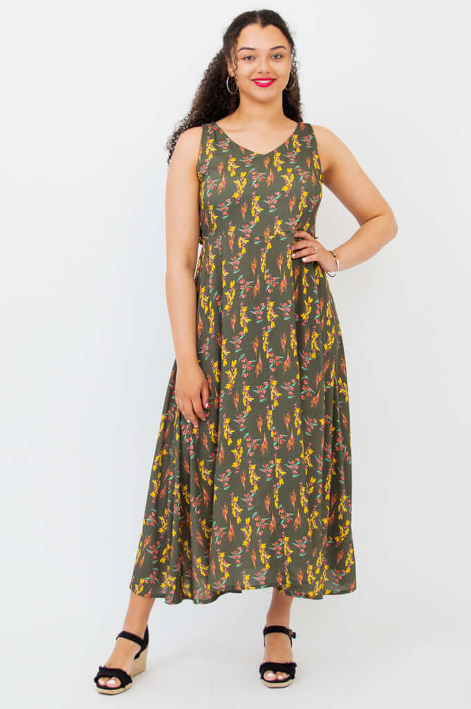 Front view of woman wearing Coraline empire waist maxi dress with floral print