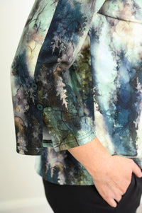 Model posing in a green patterned bamboo top, highlighting the split 3/4 bell sleeves accented with decorative buttons.