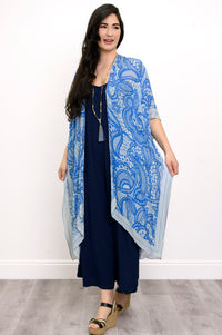Front view of woman wearing blue lace patterned kimono on navy blue outfit against a white background 