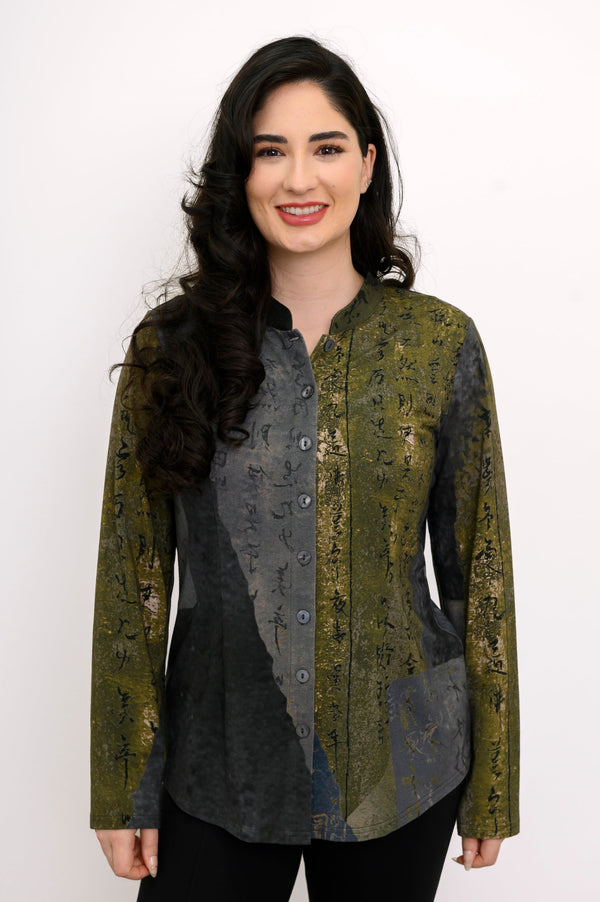Front view of a female model wearing a khaki green and grey top with black pants against a white background