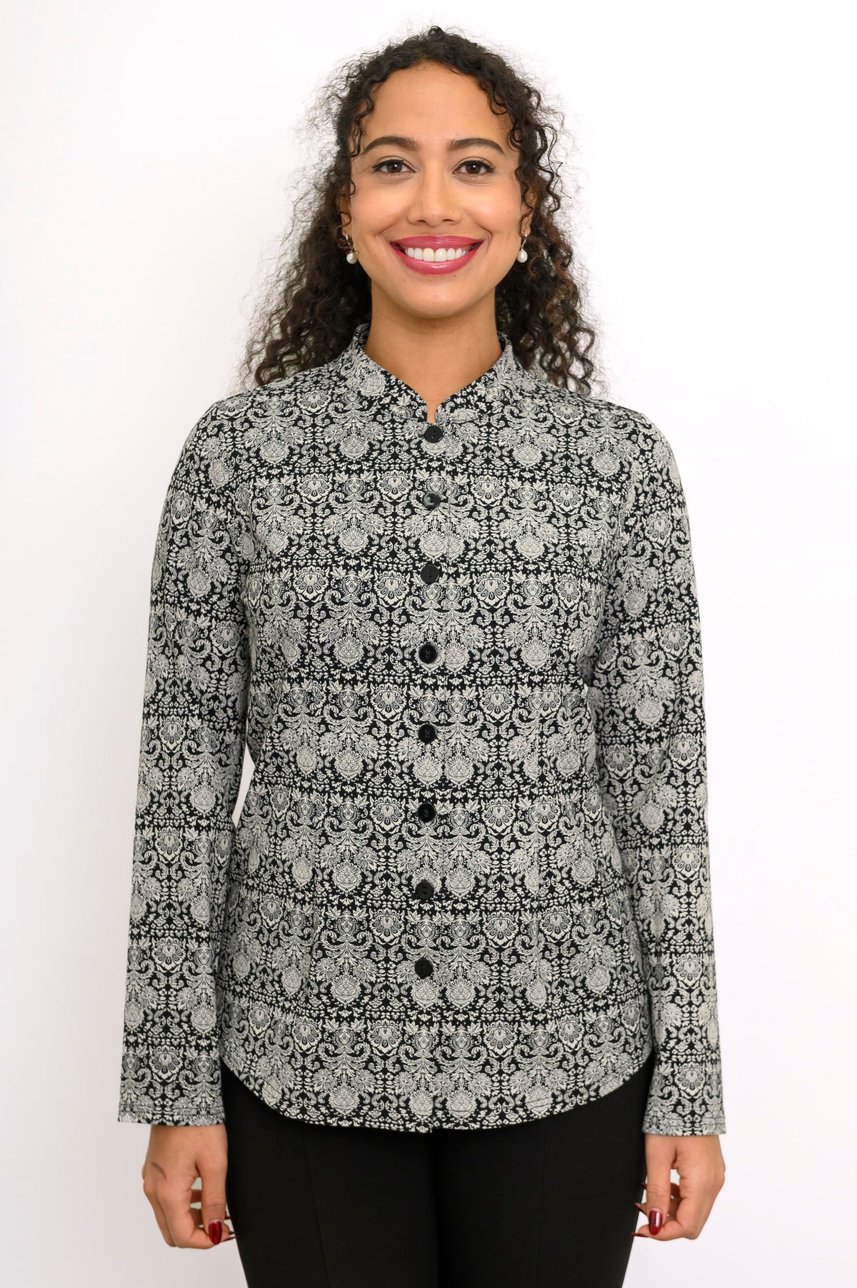Front view of a women's long sleeve grey lace-patterned top with a button placket and mandarin collar