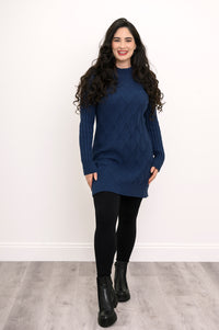 Front view of a woman modeling a breathable 100% cotton vintage indigo cable knit tunic for winter.