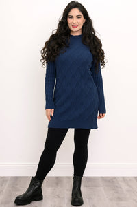 Front view of a woman wearing a vintage indigo blue diamond cable knit cotton sweater tunic.
