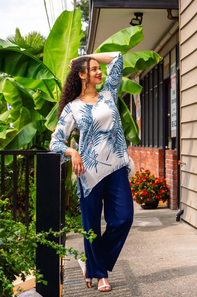 Model posing outdoors in Dorothy bohemian top with navy wide-leg pants
