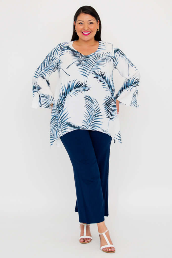Model standing in Dorothy boho top and navy pants, hands in pockets