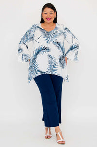 Model standing in Dorothy boho top and navy pants, hands in pockets