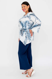 Side profile of model in Dorothy flowy top and wide-leg navy pants