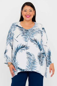 Model wearing Dorothy flowy top with blue palm print and v-neckline