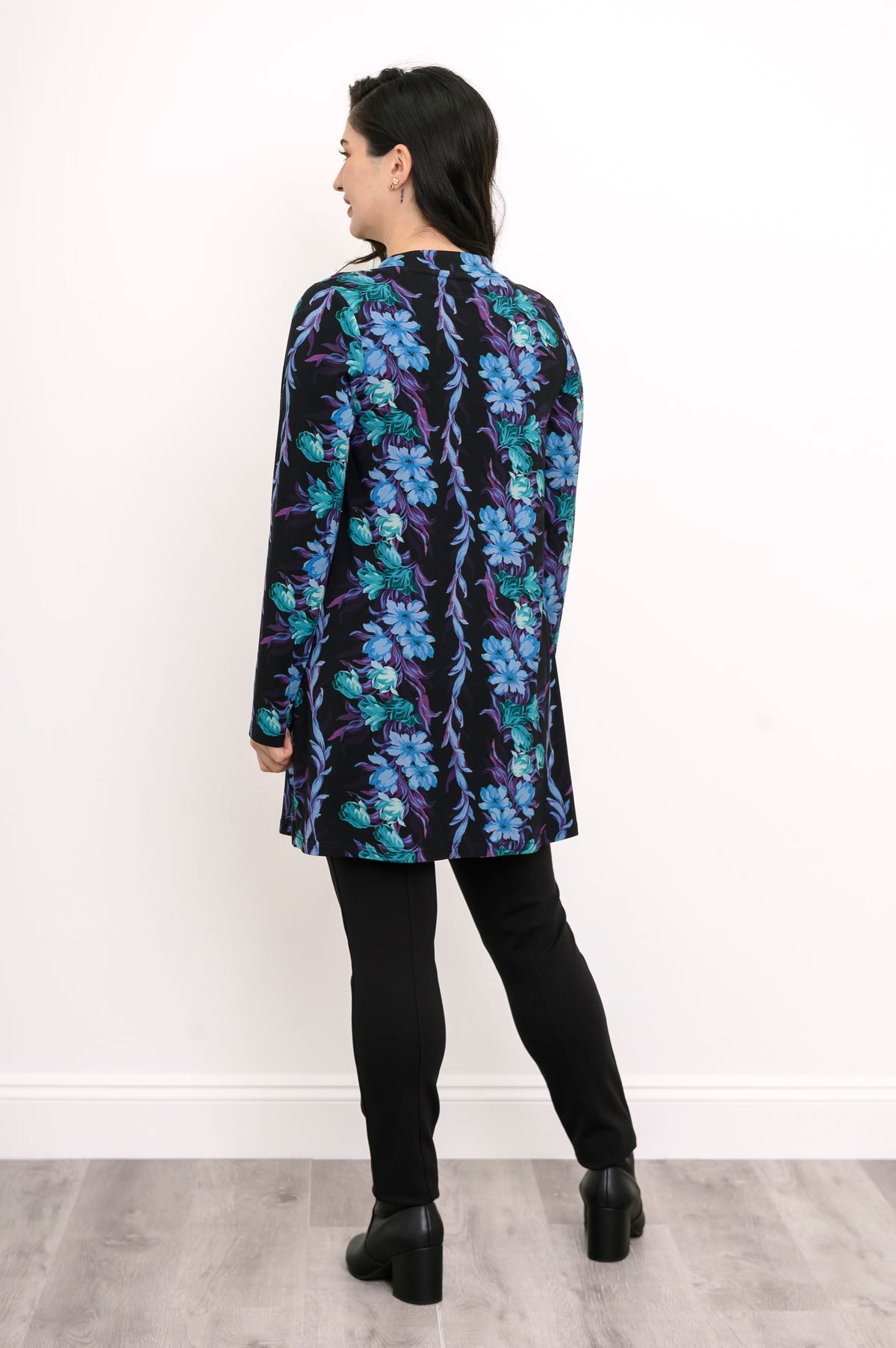 Back view of a blue and teal floral print bamboo tunic, showcasing the relaxed-fit drape and straight hemline.