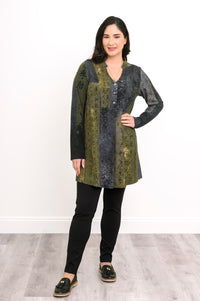 Model posing in a patterned olive-grey longline shirt with a buttoned collar and relaxed-fit long sleeves.
