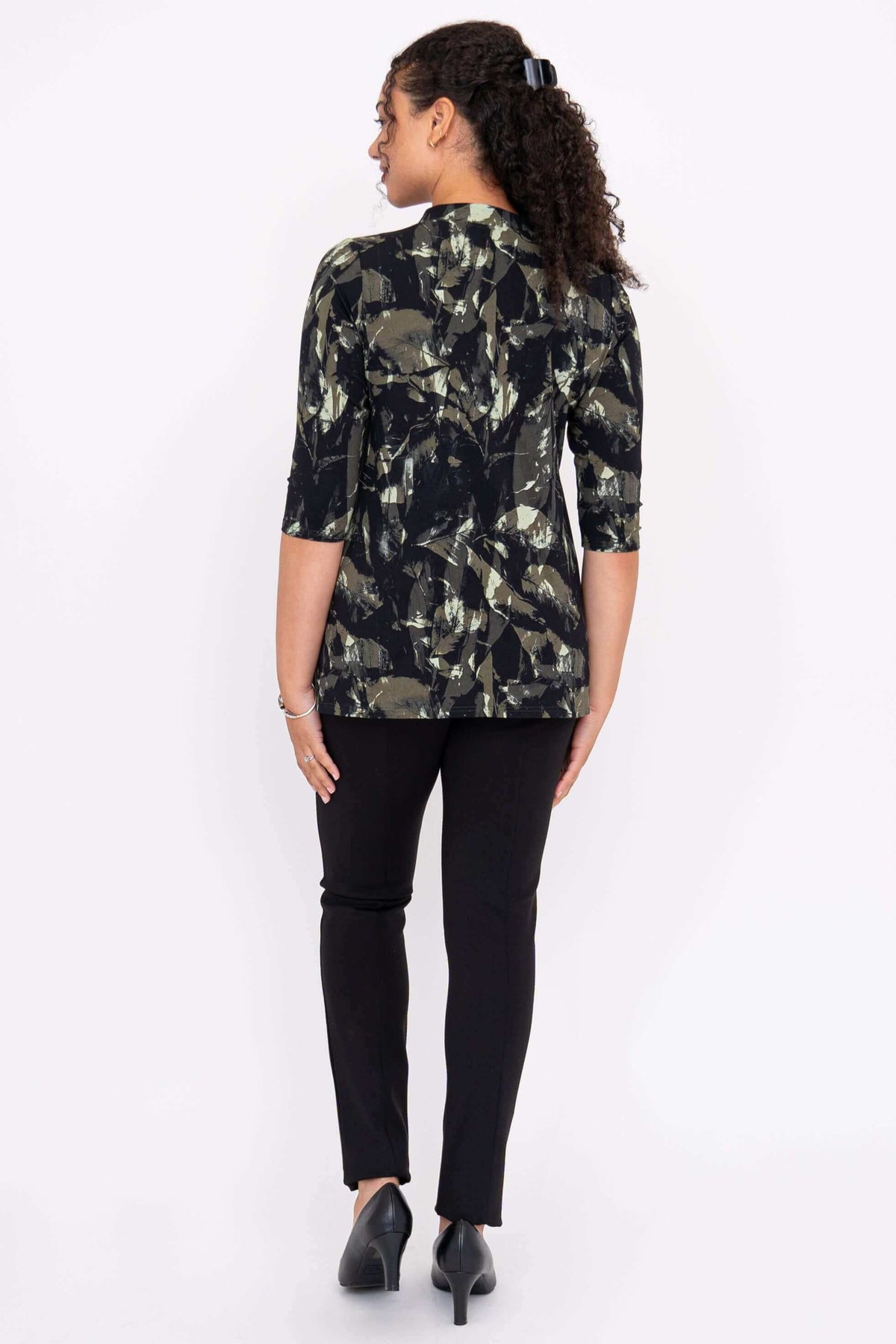 Back view of a woman wearing the Edwina abstract print top showing 3/4 sleeves
