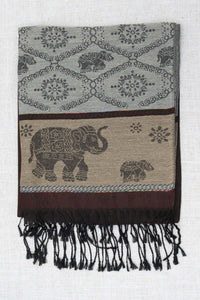 Folded pashmina scarf with intricate elephant and floral designs in grey, brown, and beige tones