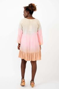 Back view of Ellie Dress showing gradient colors, ruffle hem, and sleeve detail