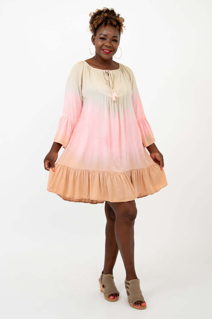 Model displaying the Ellie Dress with relaxed silhouette and flounce hem
