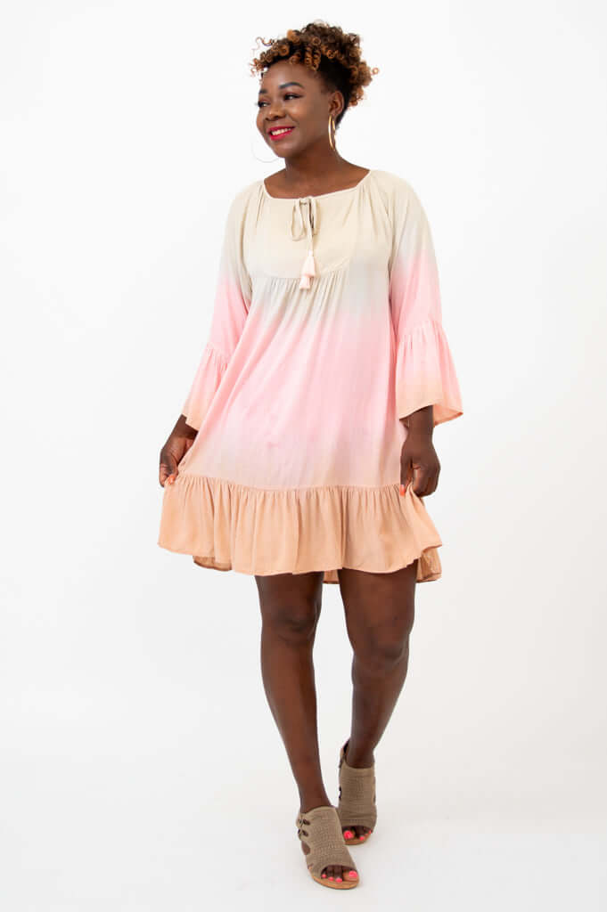 Three-quarter front view of Ellie Dress highlighting flouncy fit and tassel tie