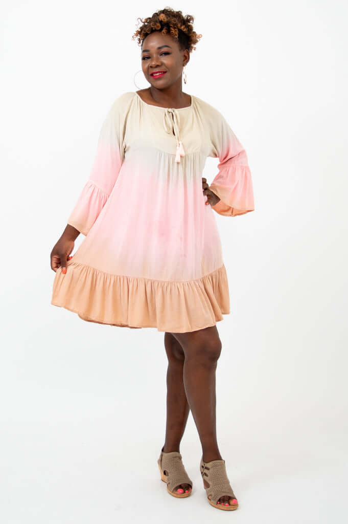 Model twirling in the Ellie Dress showing flowy movement and ruffle hem