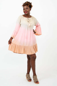 Model twirling in the Ellie Dress showing flowy movement and ruffle hem