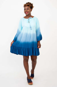 Model wearing a blue ombre Ellie Dress, showing off the flowy flounce hem and ruffle details