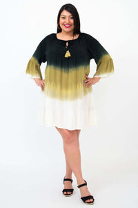 Ellie Dress modeled with hands on hips, showing the gradient color and relaxed fit