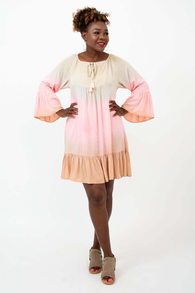 Front view of model wearing Ellie Dress with 3/4 ruffle sleeves and flounce hem