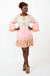 Front view of model wearing Ellie Dress with 3/4 ruffle sleeves and flounce hem
