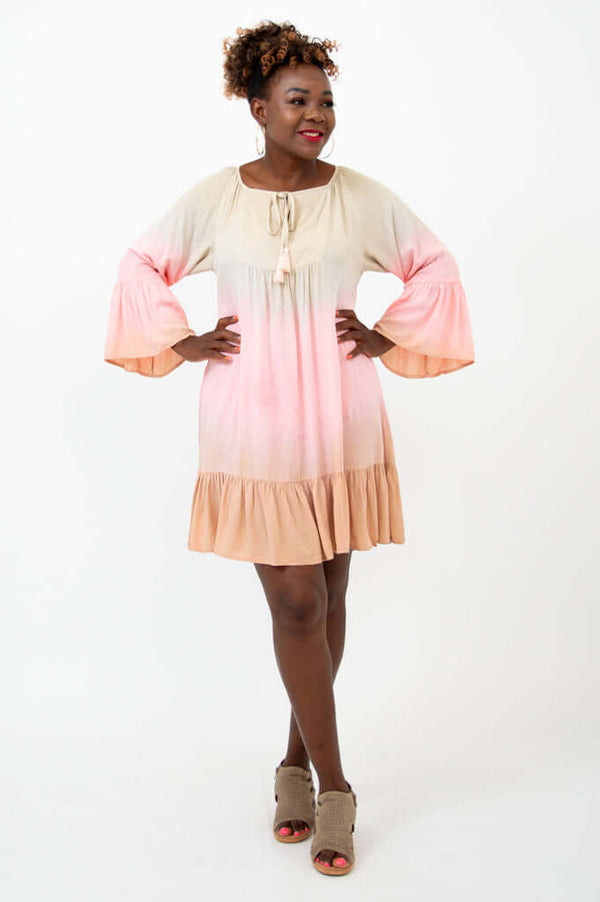 Front view of model wearing Ellie Dress with 3/4 ruffle sleeves and flounce hem