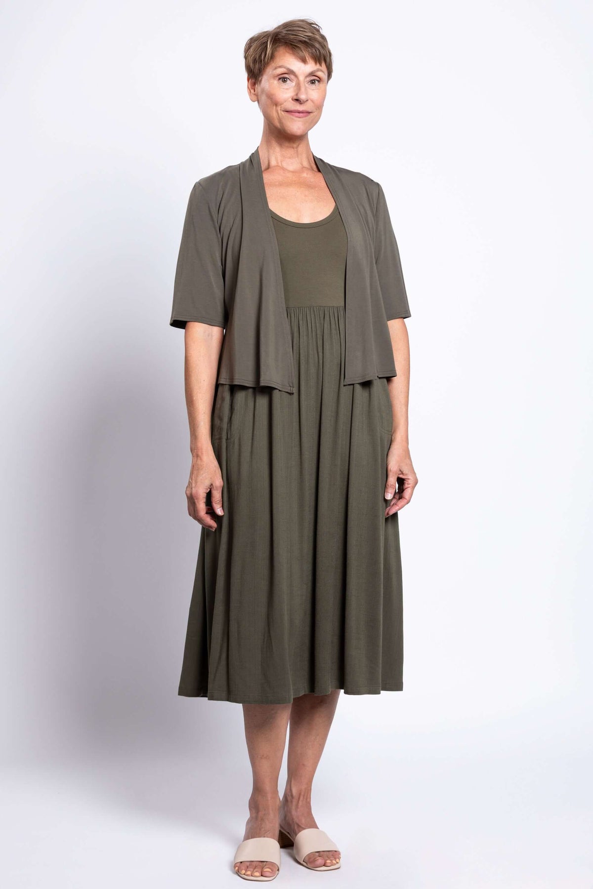 Olive green empire waist midi dress styled with a matching cardigan