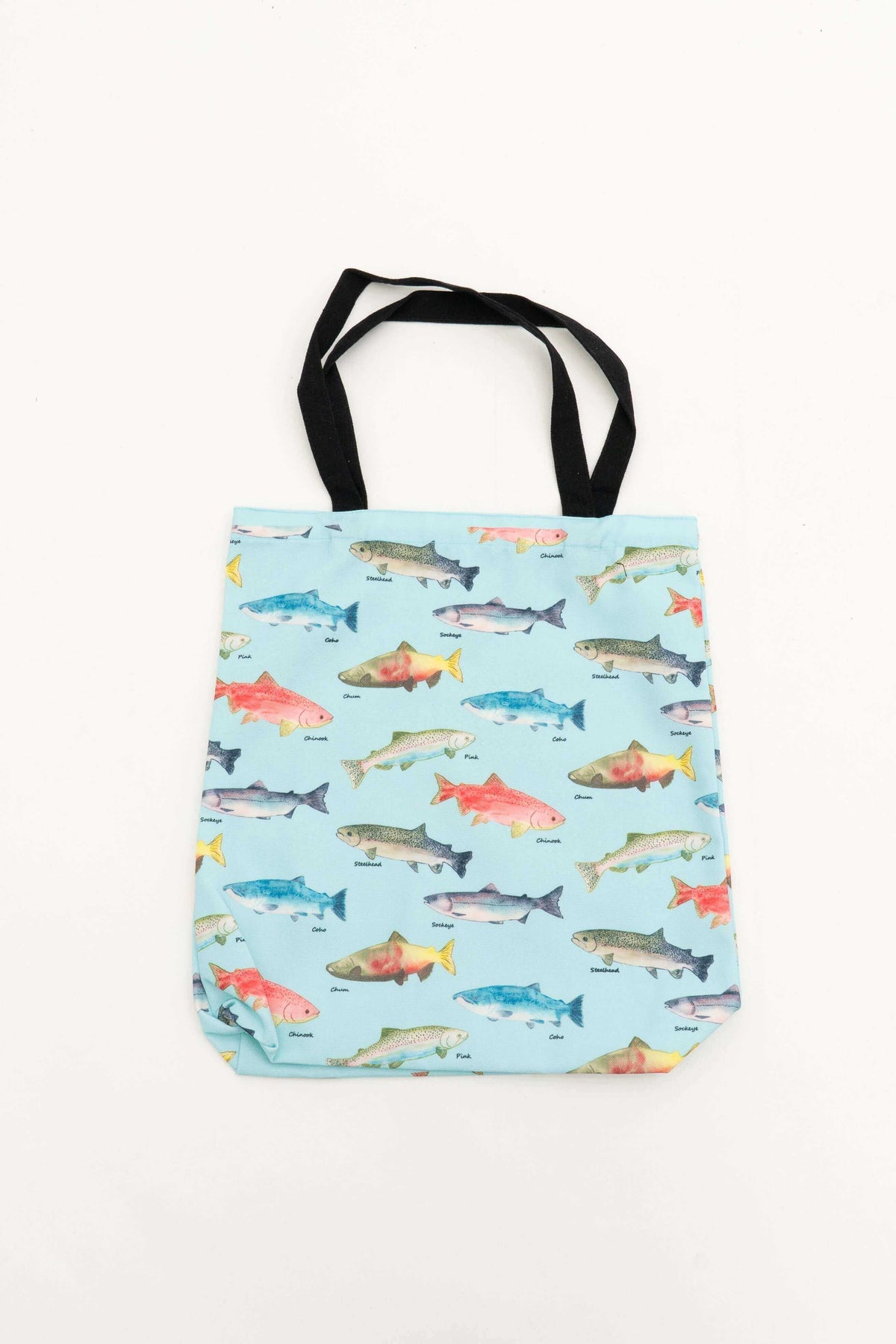 Reusable cotton canvas tote bag with colorful fish print and black handles