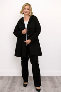 Front profile of a model showcasing a black relaxed fit hooded swing coat on a white backdrop.