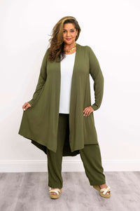 Model displaying flowy olive green open-front duster, hands holding the rounded hem
