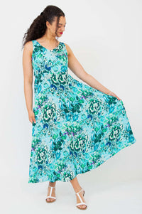 Model showcasing the flowy skirt of the Coraline aqua maxi dress