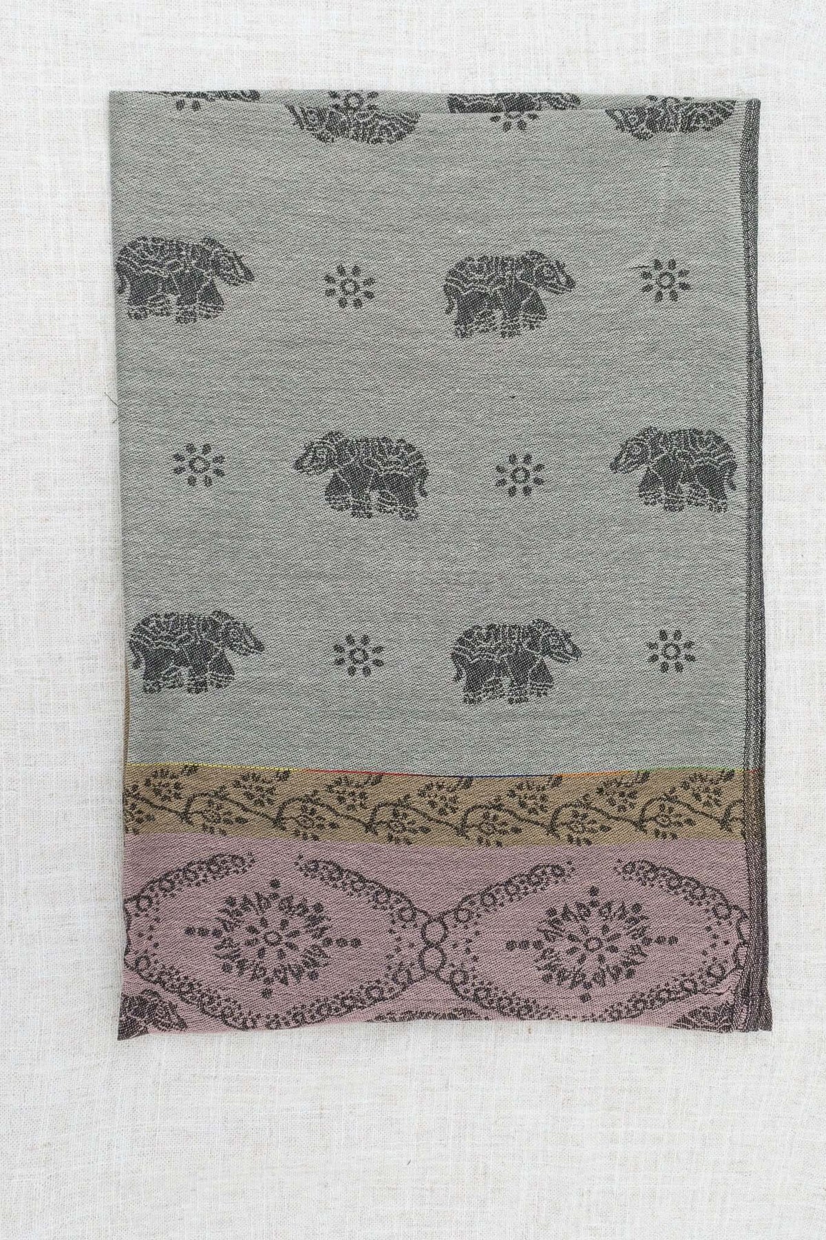 Folded pashmina scarf with elephant and floral patterns in grey, mauve, and taupe tones