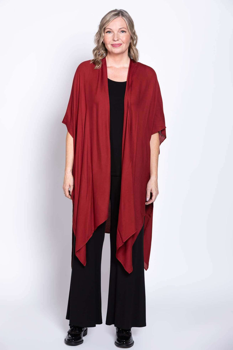 Front-facing view of a woman modeling the crimson Darcy kimono wrap