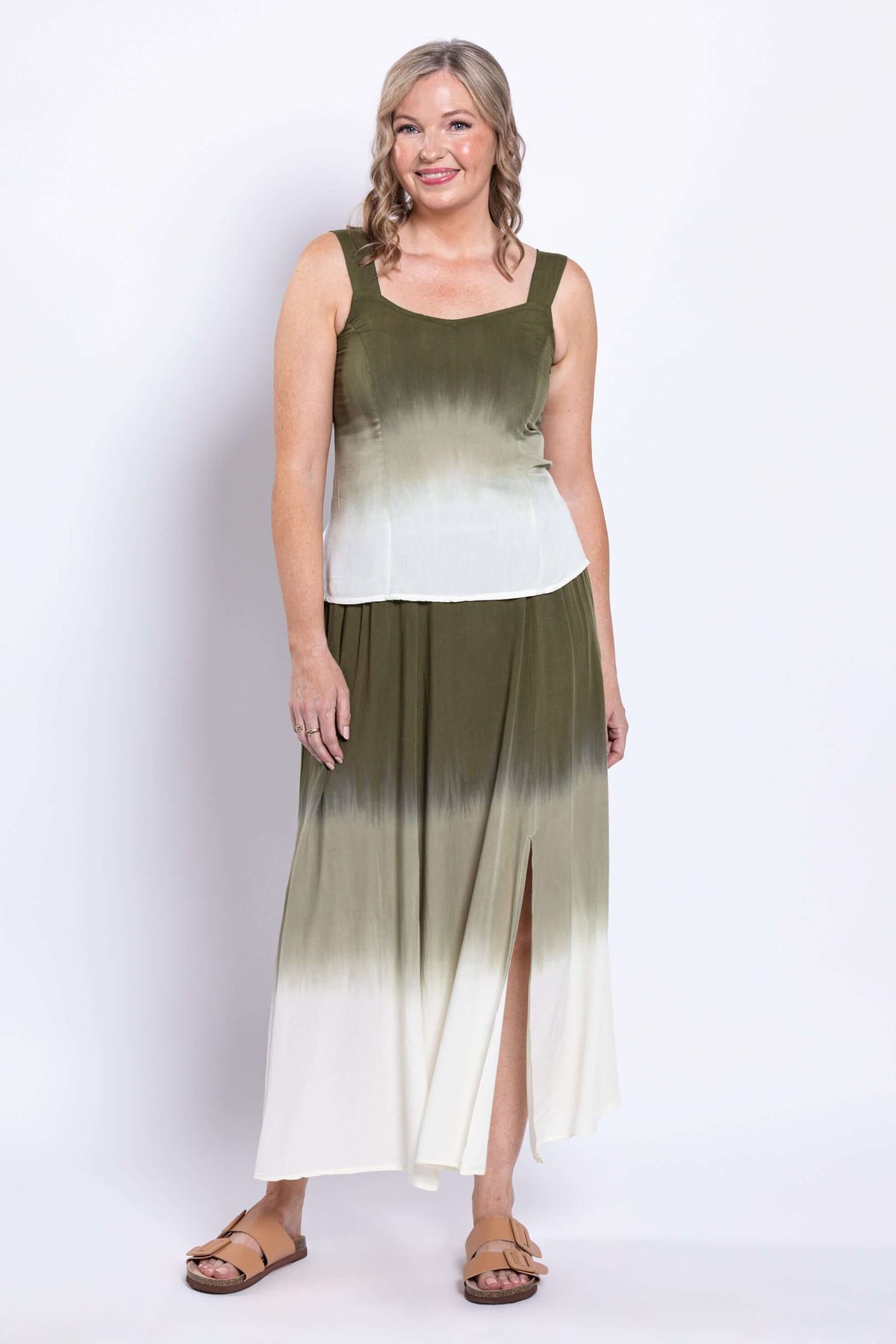 Woman wearing olive ombre sleeveless tank and skirt, front angled view
