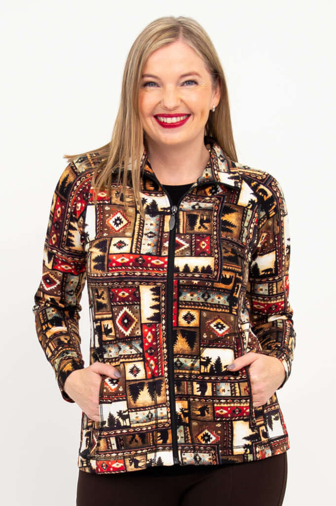 Front close-up of woman wearing an earth-tone patterned zip-up Sona jacket with pockets