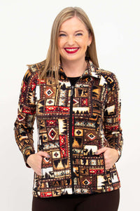 Front close-up of woman wearing an earth-tone patterned zip-up Sona jacket with pockets