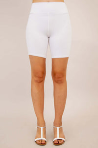 Front view of woman modeling white bamboo shorts with high waist