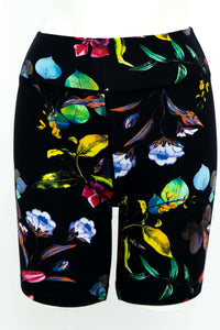 Front view of black bamboo shorts featuring a vibrant floral pattern