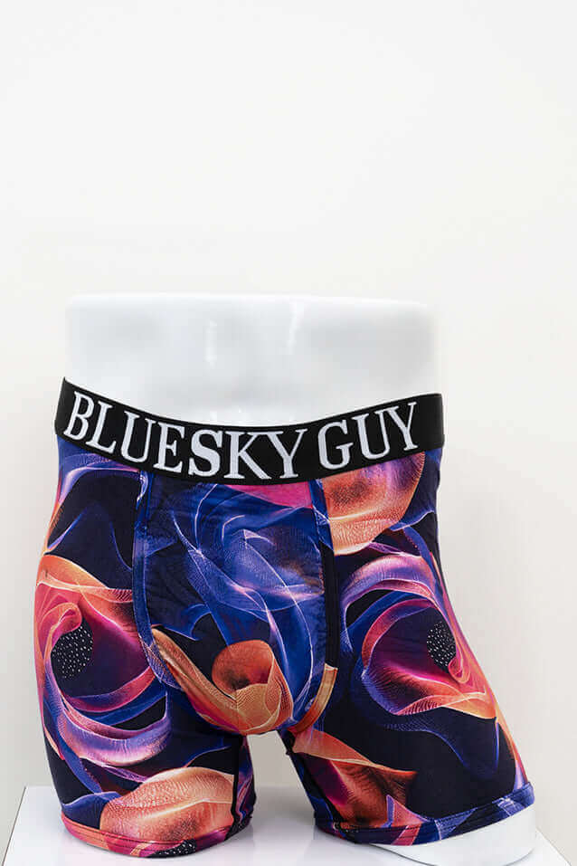Front view of Middle Man men's boxer briefs with bold swirling pattern and BLUESKY GUY waistband