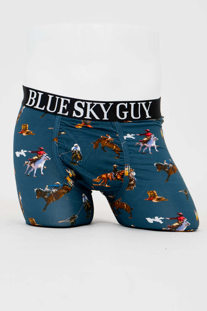 Front view of men's blue bamboo underwear with cowboy print and black BLUE SKY GUY waistband