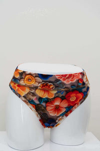 Front view of high rise thong underwear in vibrant floral bamboo fabric on a white mannequin