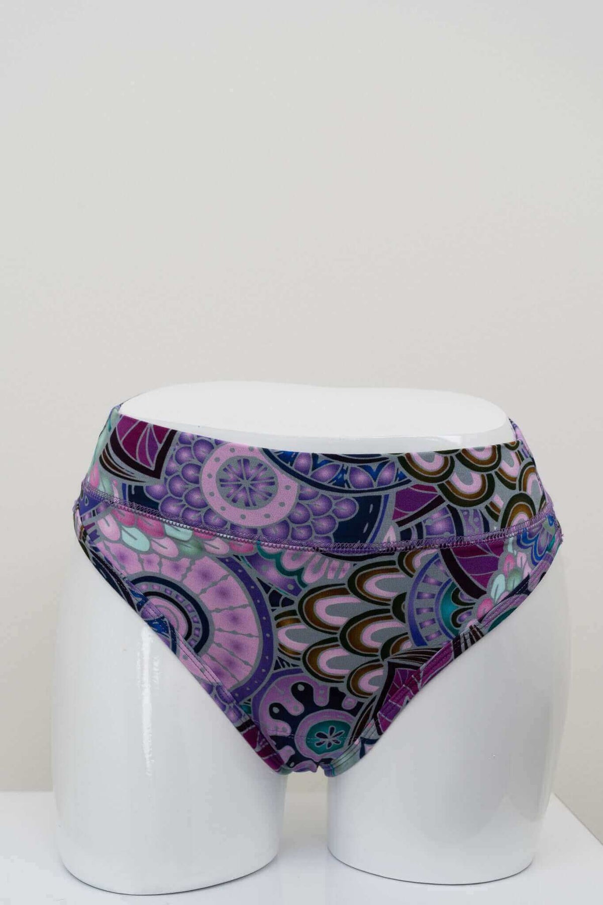 Front view of high rise bamboo thong underwear in purple geometric print on mannequin