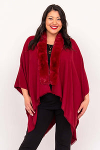 Front view of woman in red faux fur wrap with relaxed fit