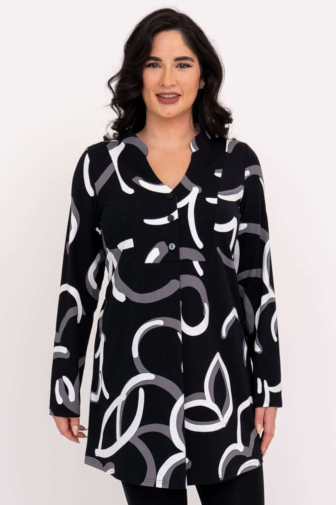 Front view of woman wearing Edwina black tunic with white and grey abstract print.