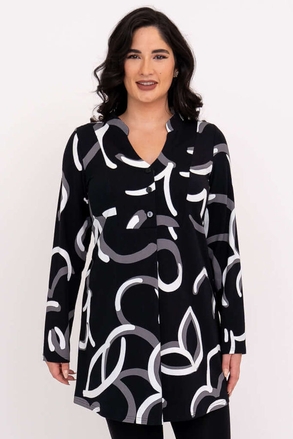 Front view of woman wearing Edwina black tunic with white and grey abstract print.