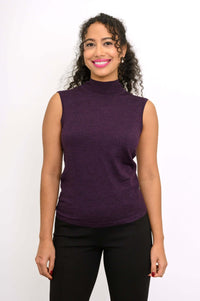 Front view of a woman wearing a sleeveless purple mock neck merino wool sweater