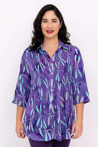 Front view of model wearing Cindy blouse in violet dragonfly print with 3/4 sleeves